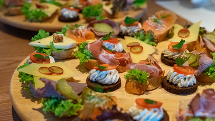 Wooden board with different appetizers