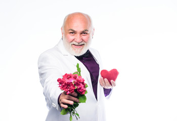 This is for you. Senior gentleman romantic. Man hold heart symbol of love. Gentleman concept. True gentleman. Handsome bearded man wear tuxedo. Romance and dating. Dating services for elderly people