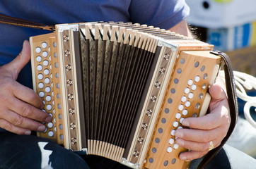 Man Playing on an Accordion.