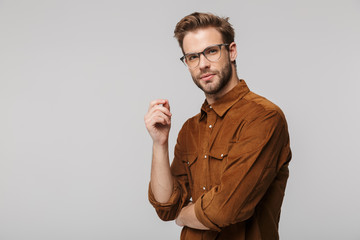 Portrait of unshaven young man posing and looking at camera