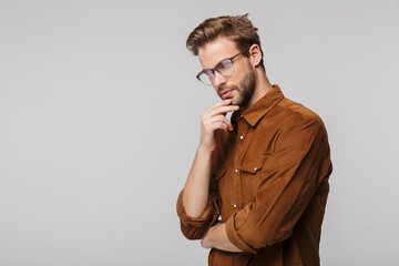 Portrait of unshaven young man posing and looking at camera