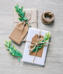 Natural style handcrafted gift boxes with rustic hemp cord.