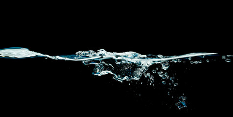 Dark water waves isolated on black background.