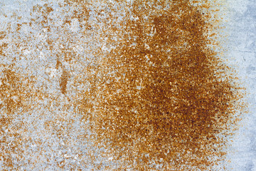 Rusty metal background . Corroded metal sheet with paint residue. Rust on an old metal background