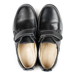 Black leather shoes isolated on white. Top view