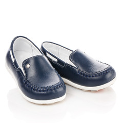 Blue leather shoes for children isolated on white