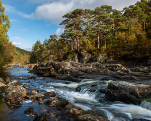 River Affric flowing through the glen in autumn