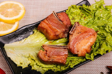 The fresh wild spareribs are roasted, sliced into different shapes and put on the plate