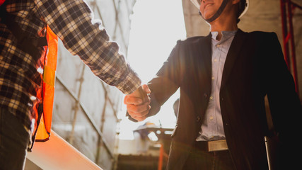 Engineers oversaw the construction site skyscraper.