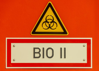 Door sign of biohazard, dangerous contamination as viral, bacterial or fungi, details, closeup
