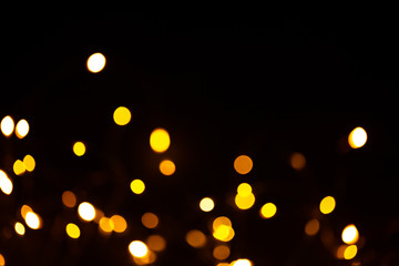 Golden sparkles raster festive background. Bokeh lights with bright shiny effect illustration. Overlapping glowing and twinkling spots decorative backdrop. Abstract glittering circles