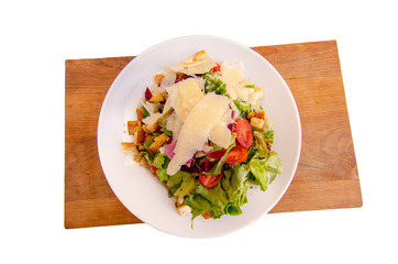Top view mediterranean salad wooden dish isolate background