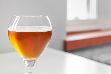 Famous Belgian beer served in small old cafe in special tulip beer glass