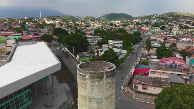 drone video of a freerunner doing trick on a tower in brazil