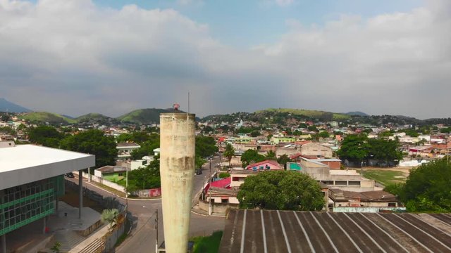 drone video of a freerunner doing trick on a tower in brazil