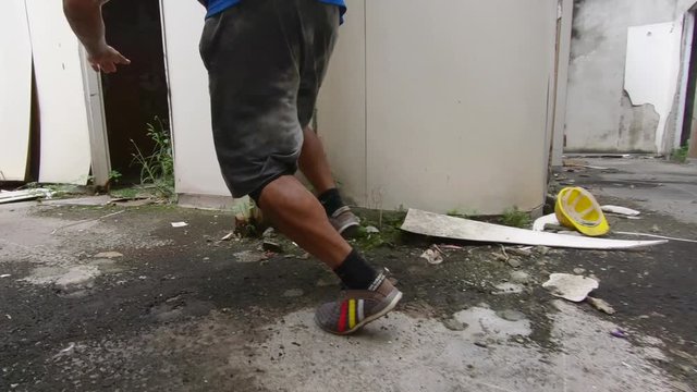 two freerunners perfom tricks, jump and climb  to escape from a building