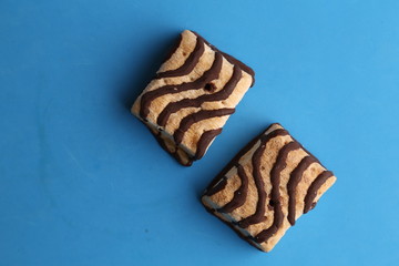 small chocolate cakes in color background