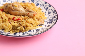 plate of rice with chicken and peppers