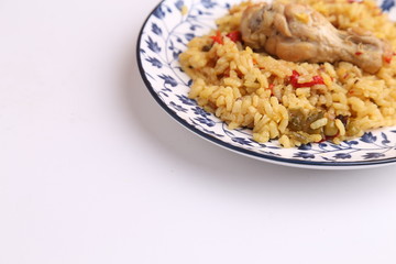 plate of rice with chicken and peppers