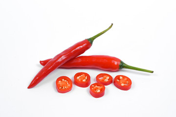Closeup top view red chili pepper with sliced on white background, raw food ingredient concept