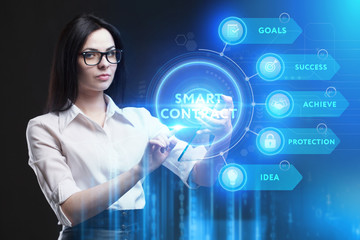 Business, Technology, Internet and network concept. Young businessman working on a virtual screen of the future and sees the inscription: Smart contract