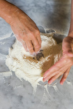 Step by step, Italian woman making homemade pasta dough, 2 of 5