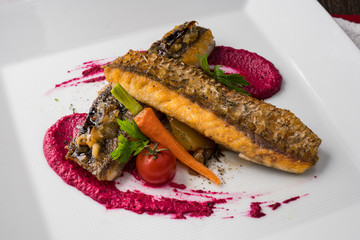 Salman steak with berry sauced topping with vegetable.