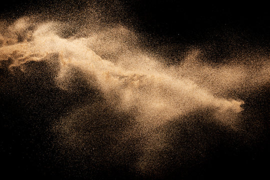 Brown Dry River Sand Explosion Isolated On Black Background. Abstract Sand Splash.