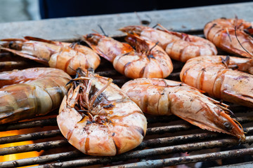 Grilled shrimps on the flaming grill.