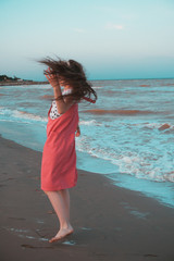 Girl dancing on the seashore
