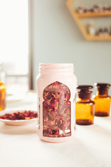 aromatherapy Rose petals on glass jar 