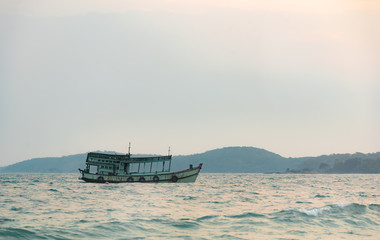 Landscape view beautiful sea with small ship boat before sunset