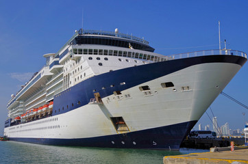 Celebrity Cruises Cruise ship or cruiseship liner in port docked at pier during summer with blue sky