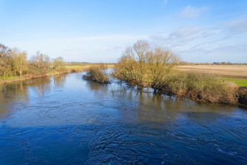 Kelham Bridge casts a shadow over the swirling River Trent