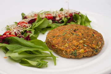 Plant-based food on white plate.