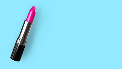 Obraz premium Pink coloured lipstick in silver container. Space to put your own content on the right side.