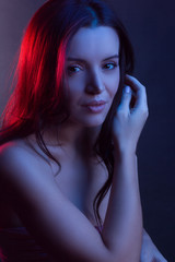 Fashionable Artistic Portrait Of A Beautiful Female Model In Bright Lights