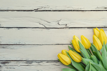 Springtime flowers. Colorful tulips on rustic wooden background. Springtime, Mother's day, Valentine's Day, Easter concept.