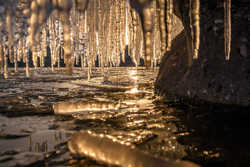 sunset ice icicles reflection mountains curtain