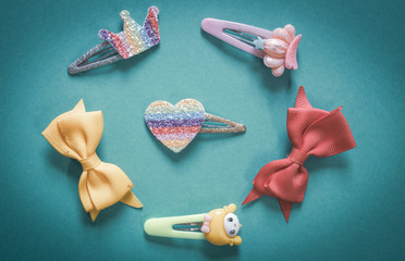 Beautiful and colourful hair clips for kids and teens on a plainbackground.
