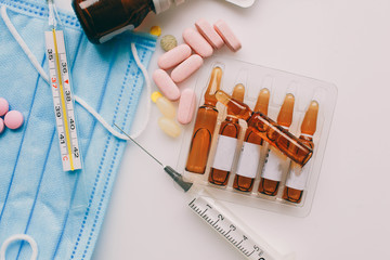 Coronavirus 2019-nCoV, MERS-Cov middle East respiratory syndrome. Wuhan pneumonia virus. Protective medical mask and medicines, pills against the virus.