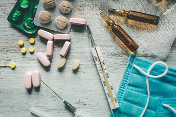 Coronavirus 2019-nCoV, MERS-Cov middle East respiratory syndrome. Wuhan pneumonia virus. Protective medical mask and medicines, pills against the virus.