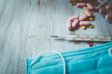 Coronavirus 2019-nCoV, MERS-Cov middle East respiratory syndrome. Wuhan pneumonia virus. Protective medical mask and medicines, pills against the virus.