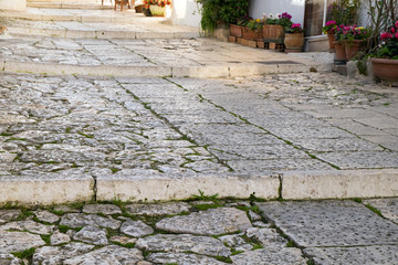 Stone, cement steps of the old staircase with traces of weathering and destruction.