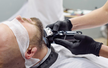 beard modeling in Barber shop, beard care for men, male beauty concept