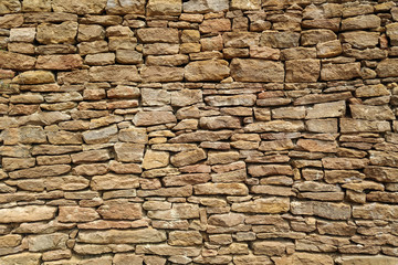 Old castle stone wall texture background. Part. Sand color, natural stone. Design.