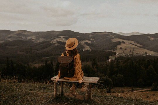 girl resting in the mountains in the mountains, enjoying the view
