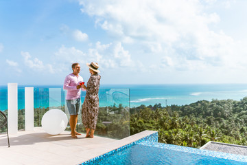 A beautiful couple spends a honeymoon in a luxurious villa with a pool and sea views. Exotic and...