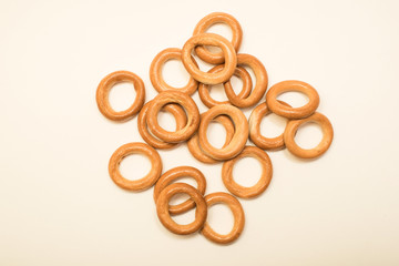 Delicious dry bagels on a white background.