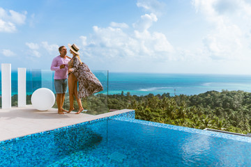 A beautiful couple spends a honeymoon in a luxurious villa with a pool and sea views. Exotic and Romance for Man and Woman in Thailand. Koh Samui